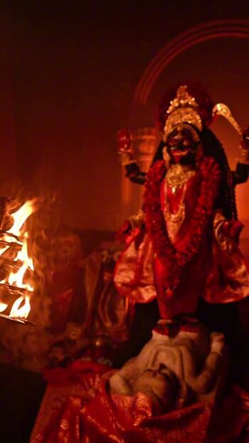 View of a deity being offered milk India.