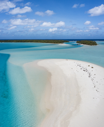 Aerial view of One Foot Island in the Aitutaki lagoon with white sandbars and turquoise water in Arutanga Cook Islands. Aerial view of One Foot Island in the Aitutaki lagoon with white sandbars and turquoise water in Arutanga Cook Islands.