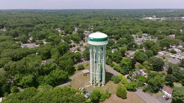 Aerial view of a water tower in the suburbs USA.