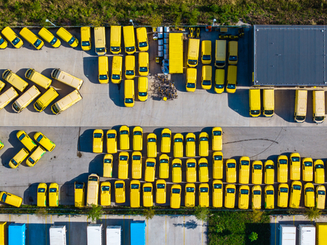 Aerial view of Logistikzentrum Allhaming with rows of yellow delivery vans parked in the logistics center in Allhaming Oberosterreich Austria. Aerial view of Logistikzentrum Allhaming with rows of yellow delivery vans parked in the logistics center in Allhaming Oberosterreich Austria.