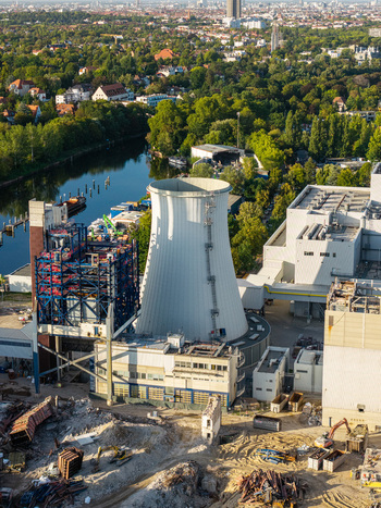 Aerial view of the Combined Heat and Power Plant Lichterfelde during its deconstruction featuring the iconic cooling tower industrial structures and the Teltow Canal in Berlin Berlin Germany. Aerial view of the Combined Heat and Power Plant Lichterfelde during its deconstruction featuring the iconic cooling tower industrial structures and the Teltow Canal in Berlin Berlin Germany.