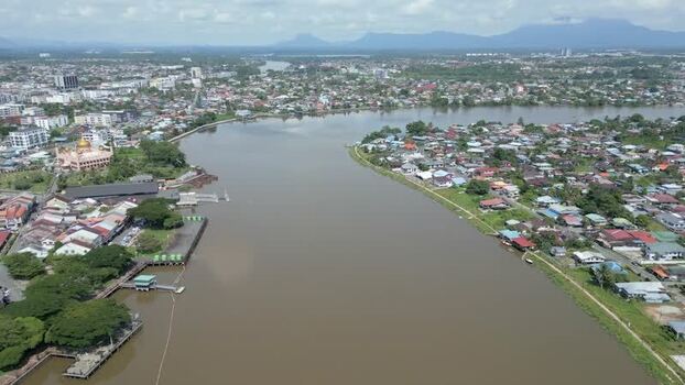 Aerial view of Sarawak River flowing through Kuching Malaysia. Aerial view of Sarawak River flowing through Kuching Malaysia.