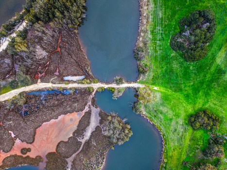 Aerial view of Point Fraser featuring wetlands winding river channels and vibrant green parklands in East Perth Western Australia Australia.