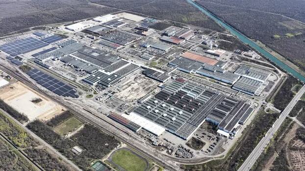 Aerial view of industrial complex with solar panels France.