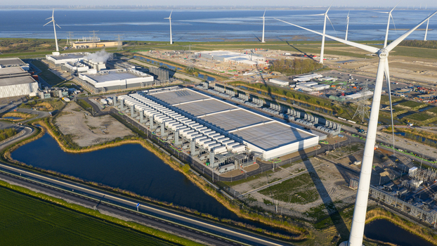 Drone view of a hyperscale data center in Eemshaven showing cloud computing server infrastructure cooling systems backup power and digital connectivity. Drone view of a hyperscale data center in Eemshaven showing cloud computing server infrastructure cooling systems backup power and digital connectivity.