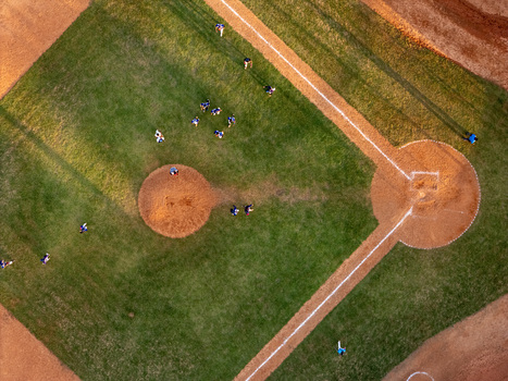 Aerial view of a baseball field with players in position on the diamond during a game in Santo Domingo Distrito Nacional Dominican Republic.