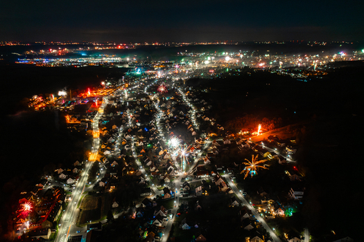 Aerial view of fireworks exploding over the illuminated streets and houses of Forchheim at night Forchheim Bavaria Germany. Aerial view of fireworks exploding over the illuminated streets and houses of Forchheim at night Forchheim Bavaria Germany.
