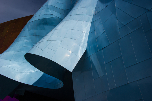 View of the metallic blue curved exterior panels of the Museum of Pop Culture in Seattle Washington United States.