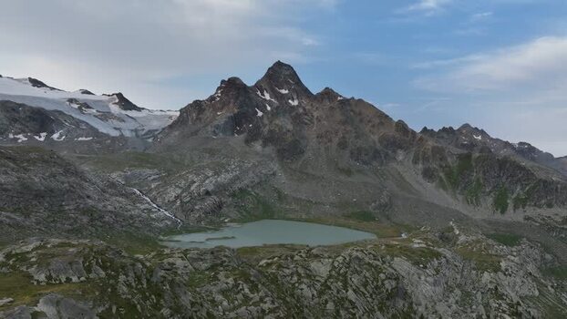 Aerial view of Rutor glacier and mountain lake in Aosta Valley Italy. Aerial view of Rutor glacier and mountain lake in Aosta Valley Italy.