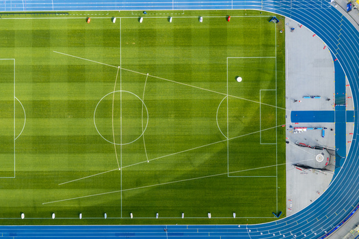 Chorzow Poland 17 September 2026 Aerial view of Silesian Stadium featuring a vibrant green football pitch and blue running track.