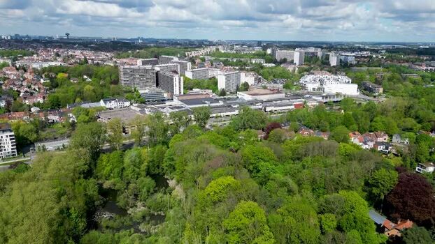 Aerial view of residential buildings and lush green parks in Belgium. Aerial view of residential buildings and lush green parks in Belgium.