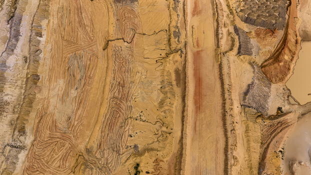 Aerial view of industrial sand and salt patterns at Useless Loop showing textured earth yellow and brown sediment and saline deposits in Kalbarri Western Australia Australia. Aerial view of industrial sand and salt patterns at Useless Loop showing textured earth yellow and brown sediment and saline deposits in Kalbarri Western Australia Australia.
