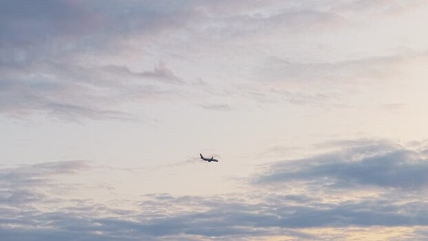 Aerial view of a passenger airplane flying over Poznan Poland.