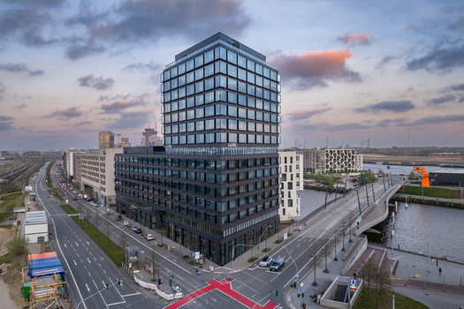 Hamburg Germany 24 April 2026 Aerial view of the modern glass architecture of the Garbe building on Versmannstrasse with surrounding urban streets and a cloudy sky at dusk. Hamburg Germany 24 April 2026 Aerial view of the modern glass architecture of the Garbe building on Versmannstrasse with surrounding urban streets and a cloudy sky at dusk.
