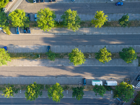 Aerial view of Parking Universiteit Hasselt with rows of parked cars lush green trees and paved parking spaces in Diepenbeek Vlaanderen Belgium. Aerial view of Parking Universiteit Hasselt with rows of parked cars lush green trees and paved parking spaces in Diepenbeek Vlaanderen Belgium.