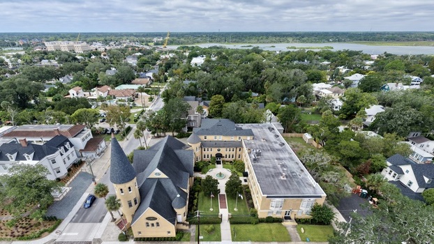 Aerial view of Ancient City Baptist Church with its distinctive steeple and courtyard surrounded by historic buildings and lush trees in St. Augustine Florida United States. Aerial view of Ancient City Baptist Church with its distinctive steeple and courtyard surrounded by historic buildings and lush trees in St. Augustine Florida United States.