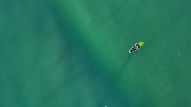 Aerial view of paddleboarder at Wrightsville Beach United States.