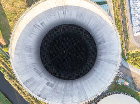 Aerial view of the Cargovil cooling tower showing its circular industrial architecture and internal grid structure at the power plant facility in Vilvoorde Vlaanderen Belgium. Aerial view of the Cargovil cooling tower showing its circular industrial architecture and internal grid structure at the power plant facility in Vilvoorde Vlaanderen Belgium.