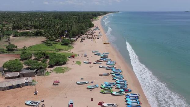 Aerial view of Trincomalee beach with boats Sri Lanka.