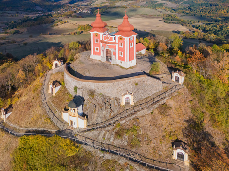 Aerial view of Stiavnica Calvary a historic pilgrimage site with red roofed chapels and stone walls on a hill in Banska Stiavnica Banskobystricky kraj Slovakia. Aerial view of Stiavnica Calvary a historic pilgrimage site with red roofed chapels and stone walls on a hill in Banska Stiavnica Banskobystricky kraj Slovakia.