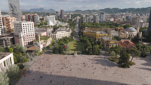 Aerial view of Skanderbeg Square with its central statue surrounding historic buildings lush trees and the urban skyline of Tirane Qarku i Tiranes Albania.