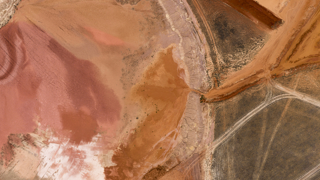Aerial view of salt production ponds featuring vibrant pink orange and earthy textures with intricate industrial patterns Kalbarri Western Australia Australia. Aerial view of salt production ponds featuring vibrant pink orange and earthy textures with intricate industrial patterns Kalbarri Western Australia Australia.