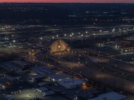 Aerial view of the iconic Union Terminal glows with warm light against the dark sky Cincinnati Ohio United States. Aerial view of the iconic Union Terminal glows with warm light against the dark sky Cincinnati Ohio United States.