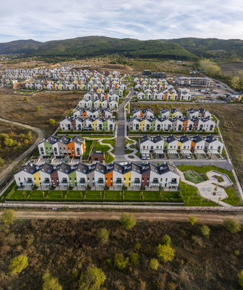 Aerial view of the Residential Park Lozen residential complex featuring colorful modern townhouses with green lawns and paved walkways in Sofia Sofia City Province Bulgaria. Aerial view of the Residential Park Lozen residential complex featuring colorful modern townhouses with green lawns and paved walkways in Sofia Sofia City Province Bulgaria.