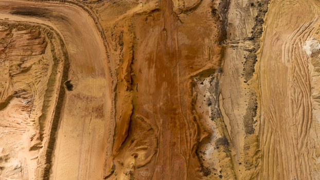 Aerial view of industrial mining patterns showing textured sand salt deposits and earth formations in a remote landscape in Kalbarri Western Australia Australia. Aerial view of industrial mining patterns showing textured sand salt deposits and earth formations in a remote landscape in Kalbarri Western Australia Australia.