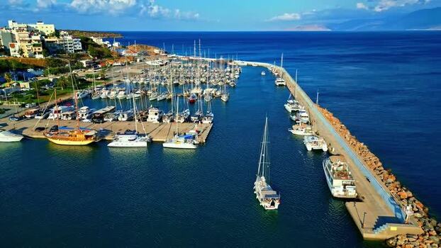 Aerial view of marina with sailboats and yachts in Crete Greece.