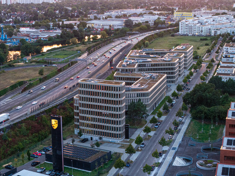 Berlin Germany 04 September 2026 Aerial view of Adlershof Brain Box Campus featuring modern office buildings with green roofs adjacent to a busy highway with traffic and urban infrastructure. Berlin Germany 04 September 2026 Aerial view of Adlershof Brain Box Campus featuring modern office buildings with green roofs adjacent to a busy highway with traffic and urban infrastructure.