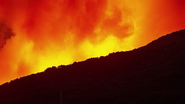 View of a volcanic eruption on a hillside in Spain.