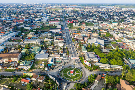 Port Harcourt Nigeria 03 July 2026 Aerial view of the urban landscape featuring a prominent roundabout busy roads dense buildings and lush greenery under a clear sky. Port Harcourt Nigeria 03 July 2026 Aerial view of the urban landscape featuring a prominent roundabout busy roads dense buildings and lush greenery under a clear sky.