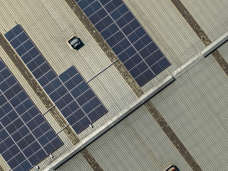 Aerial view of solar panels installed on a corrugated metal roof of a factory building in Kilsyth Victoria Australia. Aerial view of solar panels installed on a corrugated metal roof of a factory building in Kilsyth Victoria Australia.
