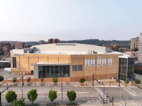 Pittsburgh Pennsylvania United States 26 July 2026 Aerial view of PPG Paints Arena showing its tan facade glass entrance and championship banners on the exterior wall.