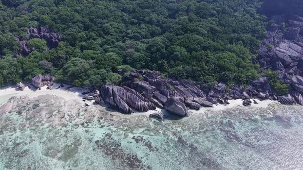 Aerial view of Anse Reunion beach and granite boulders Seychelles.