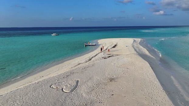 Aerial view of a white sandbank with a heart drawn in the sand Maldives. Aerial view of a white sandbank with a heart drawn in the sand Maldives.
