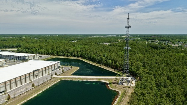 Aerial view of a tall telecommunications tower near the intersection of Saint Johns Parkway and International Golf Parkway in World Golf Village Florida United States. Aerial view of a tall telecommunications tower near the intersection of Saint Johns Parkway and International Golf Parkway in World Golf Village Florida United States.