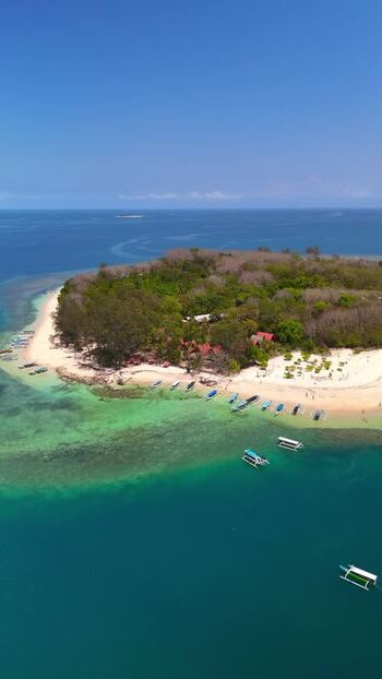 Aerial view of Gili Nanggu island and turquoise waters Indonesia. Aerial view of Gili Nanggu island and turquoise waters Indonesia.