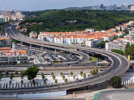 Aerial view of the highway interchange and bus terminal in Alges Lisbon Portugal.