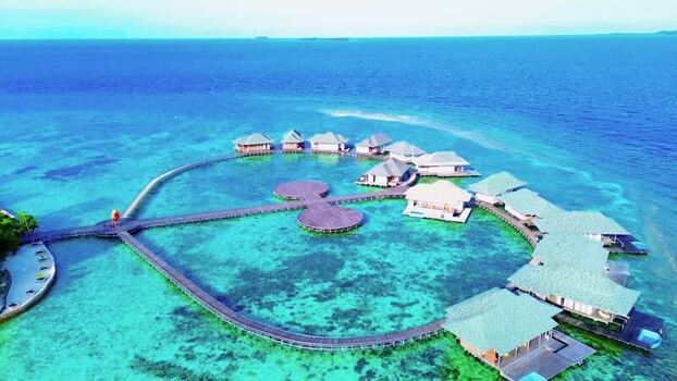 Aerial view of overwater villas in Karimunjawa National Park Indonesia. Aerial view of overwater villas in Karimunjawa National Park Indonesia.