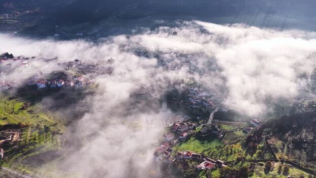 Aerial view of Avo village covered in morning fog Portugal. Aerial view of Avo village covered in morning fog Portugal.