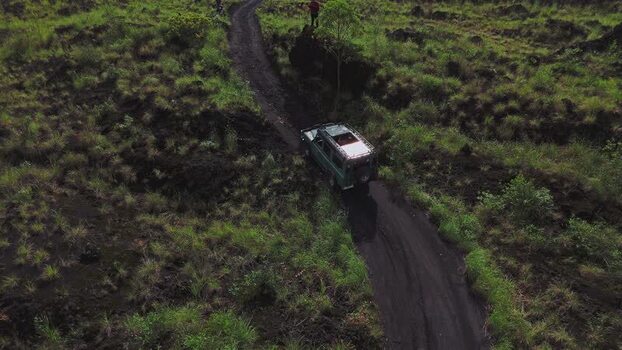 Aerial view of off road vehicle on Mount Batur trail Indonesia. Aerial view of off road vehicle on Mount Batur trail Indonesia.