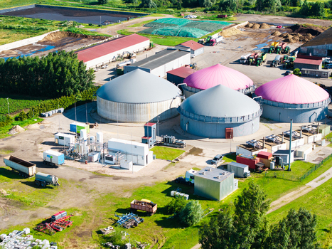 Iecava Bauska Municipality Latvia 05 July 2026 Aerial view of a biogas production station with large circular tanks some with pink covers industrial buildings and green fields. Iecava Bauska Municipality Latvia 05 July 2026 Aerial view of a biogas production station with large circular tanks some with pink covers industrial buildings and green fields.