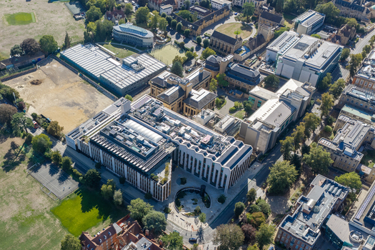 Aerial view of the Big Data Institute at the University of Oxford featuring modern research buildings green spaces and surrounding campus infrastructure in Oxford England United Kingdom. Aerial view of the Big Data Institute at the University of Oxford featuring modern research buildings green spaces and surrounding campus infrastructure in Oxford England United Kingdom.