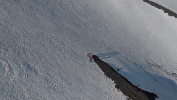 Aerial view of people on the snowy slopes of Mount Etna Italy. Aerial view of people on the snowy slopes of Mount Etna Italy.