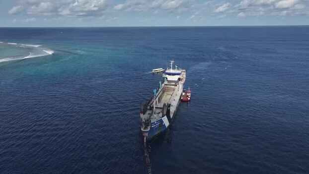 Aerial view of a large dredger ship in the ocean Maldives. Aerial view of a large dredger ship in the ocean Maldives.