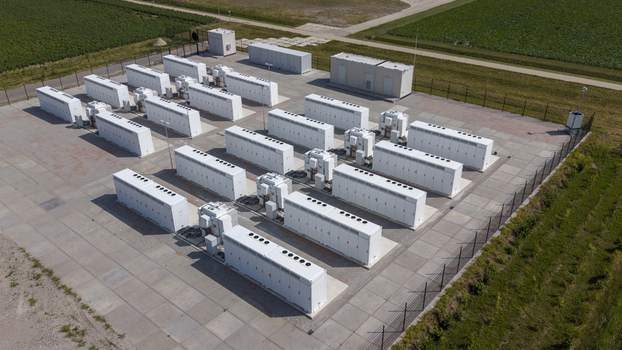 Aerial view of the Battery Energy Storage System at Wind Park with rows of white storage containers and electrical infrastructure in Dronten Flevoland Netherlands. Aerial view of the Battery Energy Storage System at Wind Park with rows of white storage containers and electrical infrastructure in Dronten Flevoland Netherlands.