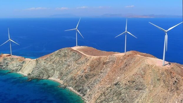 Aerial view of wind turbines on a rocky ridge in Greece. Aerial view of wind turbines on a rocky ridge in Greece.