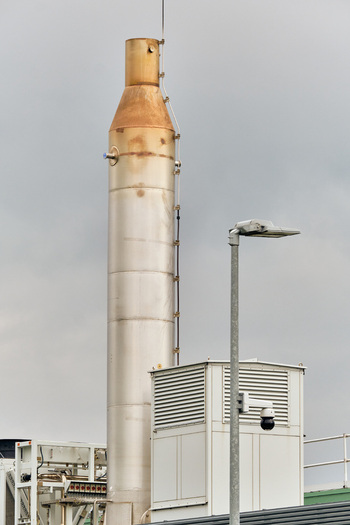 Middenmeer Netherlands 17 May 2026 View of Microsoft datacenters Western Europe on Agriport featuring an industrial exhaust stack and security camera under a cloudy sky.